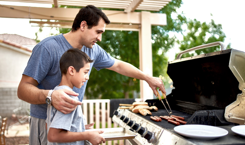 Father and Son Grilling with a Made in the USA badge
